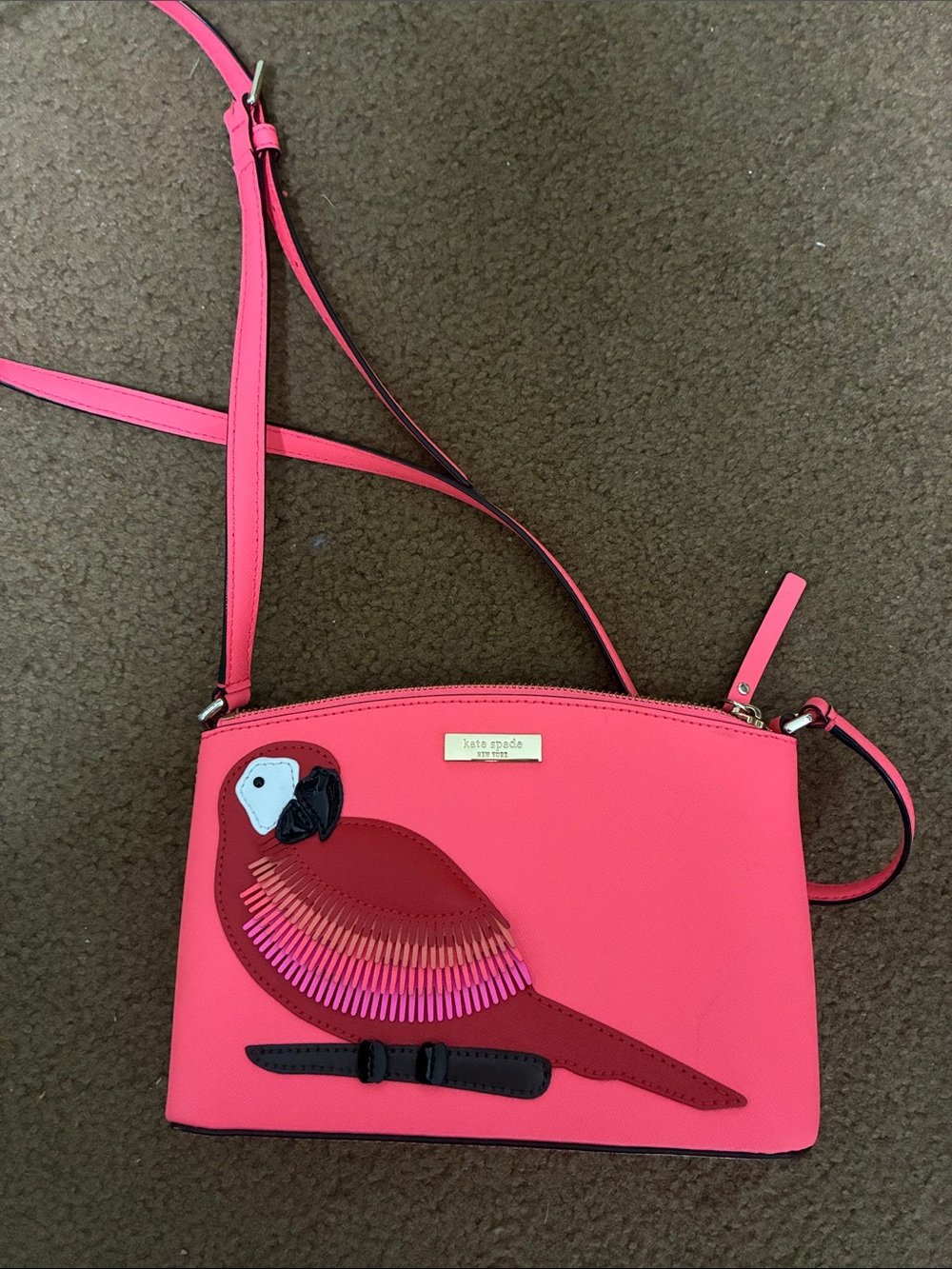 kate spade hot pink crossbody with parrot appliqué